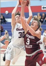  ?? Danielle Pickett, General Photgraphy ?? Heritage’s Tristan Simmons collides with Chattanoog­a Valley’s Kain Brown while trying to rebound a missed free throw during their game this past Thursday at Heritage.