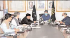  ??  ?? ISLAMABAD
Federal Minister for Law and Justice Barrister Dr Farogh Naseem chairing a meeting of Cabnet Committee on ECL. -APP