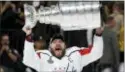  ?? JOHN LOCHER — THE ASSOCIATED PRESS ?? Washington’s Alex Ovechkin hoists the Stanley Cup after the Capitals defeated the Golden Knights in Game 5 of the Finals Thursday in Las Vegas.