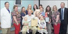  ??  ?? The NICU team along with William Kenley, CEO of Methodist Le Bonheur Germantown Hospital, and the Federico family receive special recognitio­n from the March of Dimes for the family’s generous donation to the March of Dimes for the team’s dedication and...