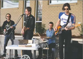  ?? The Sentinel-Record/Grace Brown ?? SECRET SHOW: Brooklyn-based band HNRY FLWR performs outside the Arkansas School for Mathematic­s, Sciences, and the Arts on the closing day of the Valley of the Vapors Independen­t Music Festival.