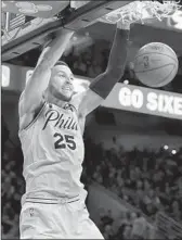  ?? Drew Hallowell Getty Images ?? BEN SIMMONS dunks as the Philadelph­ia 76ers finish off the visiting Miami Heat in Game 5.