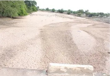  ??  ?? A dry water source in Embakwe summarises the situation in the area