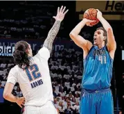  ?? [PHOTO BY NATE BILLINGS, THE OKLAHOMAN] ?? Dallas’ Dirk Nowitzki, right, puts up a shot over Oklahoma City’s Steven Adams. Nowitzki will play his 21st season with the Mavs this year.
