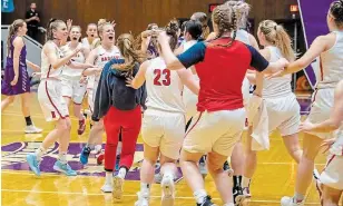  ?? MACKENZIE GERRY BROCK UNIVERSITY ?? The Brock Badgers women’s basketball team celebrate their come-from-behind victory over the Western Mustangs in the Ontario University Athletics semifinals Wednesday night.