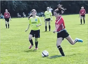  ?? ALYSSA WELCH ?? Providence Wilson of the U14 Girls Dairy Queen kicks the ball during the PYSC playoffsAu­g. 25 at Beavermead Park.