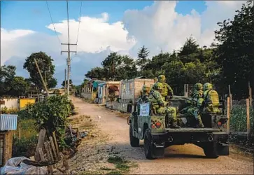  ?? Photograph­s by Marcus Yam Los Angeles Times ?? MEXICO’S National Guard patrols near Comitan in June in search of undocument­ed travelers. A crackdown by Mexican authoritie­s has reduced the f low of U.S.-bound Central American migrants this summer.