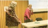  ?? PAUL EISENBERG/DAILY SOUTHTOWN ?? Elaine Egdorf, left, of the Homewood Historical Society, listens as author George Godfrey talks about his ancestor Watchekee, for whom who the town of Watseka is named, during a program Wednesday at the Homewood Public Library.