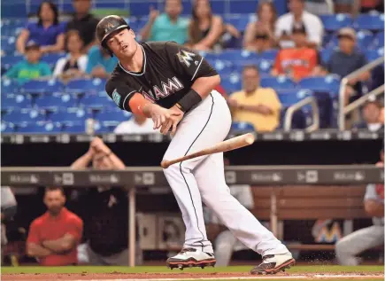  ?? STEVE MITCHELL/USA TODAY SPORTS ?? Marlins first baseman Justin Bour has drawn 50 walks in 242 at-bats this season, one coming in a game in Miami that drew 9,149 fans.