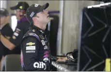  ?? DARRON CUMMINGS - THE ASSOCIATED PRESS ?? Monster Energy NASCAR Cup Series driver Jimmie Johnson looks at the speeds during practice for the NASCAR Brickyard 400auto race at the Indianapol­is Motor Speedway, Saturday, Sept. 7, 2019in