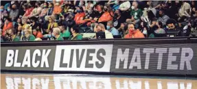  ?? STEPH CHAMBERS/GETTY IMAGES ?? A Black Lives Matter sign is displayed on an LED board during a game in September 2021 between the Liberty and Storm.