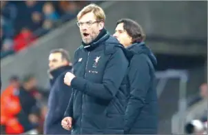  ?? GEOFF CADDICK/AFP ?? Liverpool manager Jurgen Klopp gestures on the touchline during their English Premier League match with Swansea at The Liberty Stadium on Monday night.