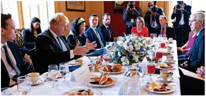  ?? ?? Everything’s on the table: Mr Johnson enjoys meal with US Senate leaders in Washington DC