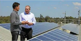  ?? PHOTO: CONTRIBUTE­D ?? POWERING UP: Yellow Solar director Matt Buchanan and Western Downs Regional Council Mayor Paul McVeigh (right) discuss renewable energy.