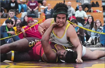  ?? DANA JENSEN/THE DAY ?? New London’s Henry Santana-Liriano and Fitch’s Nastier Matthews compete during their 285 lbs wrestling tournament championsh­ip title match on Saturday at Killingly High School.