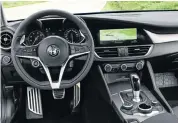  ??  ?? The interior, left, features some of the best ergonomics in the business. Below: Even this entrylevel model has a look that defines its place as a true sports sedan.