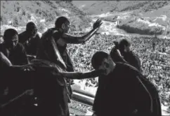  ?? AP ?? The Dalai Lama waves to supporters in Arunachal Pradesh, April 6. The exiled Tibetan spiritual leader's visit to the state was a point of friction between India and China.