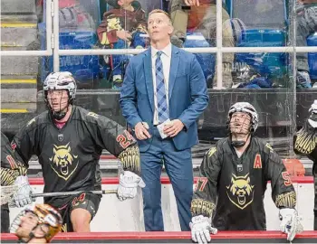  ?? Jim Franco/Times Union archive ?? Albany Firewolves head coach Glenn Clark, center, faced his son Taggart for the first time in a 15-10 victory Saturday at the Philadelph­ia Wings.