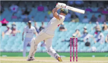  ?? (Photos: AFP) ?? Australia’s Cameron Green plays a shot on the fourth day of the third cricket Test match between Australia and India at Sydney Cricket and Sports Ground in Sydney on Sunday.