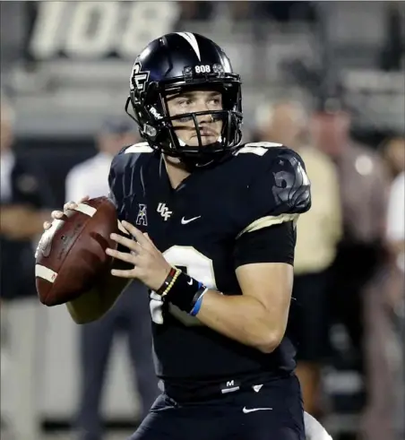  ?? Associated Press ?? Central Florida quarterbac­k McKenzie Milton hopes to play again next season, but until then he is getting a head start on a possible post- playing career.