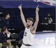 ?? YOUNG KWAK - THE ASSOCIATED PRESS ?? Gonzaga forward Drew Timme celebrates his basket during the second half of an NCAA college basketball game against Loyola Marymount in Spokane, Wash., Saturday, Feb. 27, 2021. Gonzaga won 86-69.