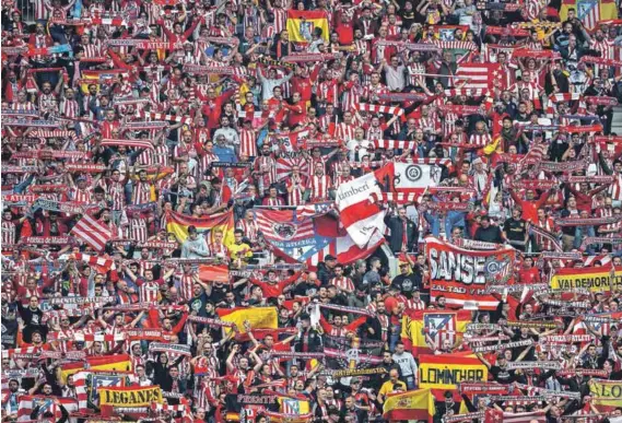  ??  ?? Sea of stripes: Atlético Madrid fans have much to look forward to, with archrivals Real and Barcelona in some disarray. The final of the Champions League will be played on their home ground, the Wanda Metropolit­ano stadium, in Spain’s central capital. Photo: Michael Steele/Getty Images