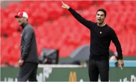  ??  ?? Mikel Arteta and Jürgen Klopp on the touchline at Wembley. Photograph: Eddie Keogh for The FA/Shuttersto­ck