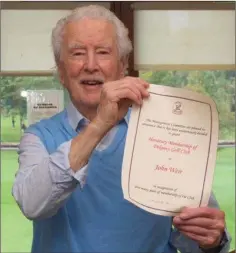  ??  ?? John Weir with his Honorary Membership of Delgany Golf Club.