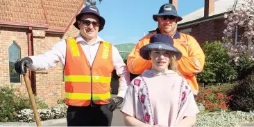  ??  ?? Merri Spalding of Christ Church is assisted by Baw Baw Shire coordinato­r parks, gardens and sports fields Andrew Davidson and Shire employee Glenn Barnes to dig the hole for planting of a commemorat­ive elm tree.