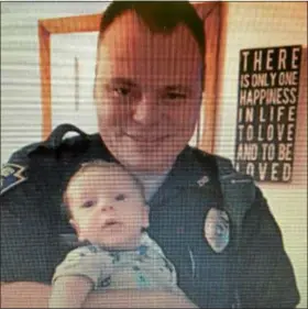  ?? SUBMITTED PHOTO ?? In this family photo, Chester Police Officer Christophe­r Senkow holds his newborn son Hunter.