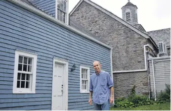  ?? DAVID JALA/CAPE BRETON POST ?? Jim MacDonald says it is with mixed emotions that he is putting the 18th-century O’Brien House up for sale. The old structure is located adjacent to the stone St. Patrick’s Church on the Esplanade in Sydney’s historic north end.