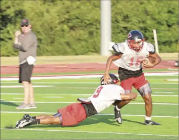  ??  ?? Cyclone junior Alex Bonilla tackles sophomore Mykai Foster.