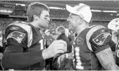  ?? CHARLES KRUPA/ASSOCIATED PRESS ?? Patriots QB Tom Brady, left, and Aaron Hernandez celebrate their AFC title-game win against the Ravens in 2012.