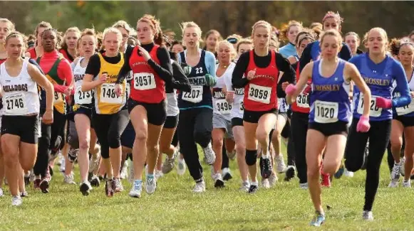  ?? RENE JOHNSTON/TORONTO STAR ?? Girls start out running the same distance as boys in cross-country. But once they reach high school, and until they’re running in masters events, girls (and women) have their races cut short.