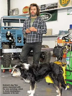  ??  ?? Graham’s dog Tess seems impressed with the new workshop, which is slowly developing a character of its own