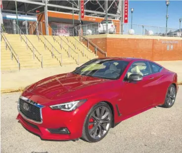  ?? STAFF PHOTOS BY MARK KENNEDY ?? The 2018 Infiniti Q60 Red Sport 400 is shown in vibrant Dynamic Sunston paint.