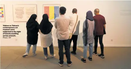  ?? Photo / AP ?? Visitors to Tehran’s contempora­ry art museum were subjected to the sight of insects scuttling across artwork.