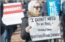  ?? ZACH GIBSON/GETTY ?? A protester at the White House on Monday opposes the emergency declaratio­n.