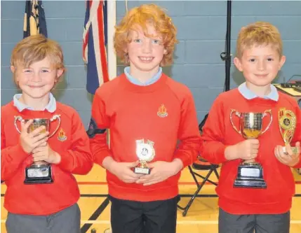  ??  ?? Top lads With their trophies are Samuel Spokes, Anchor Boy sportsmans­hip; Daniel Evans, runner-up Anchor Boy best boy and Peter Siganos, Anchor Boy best boy