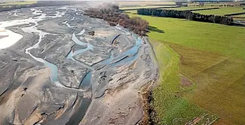  ??  ?? An example of farmland encroachin­g onto a braided river.