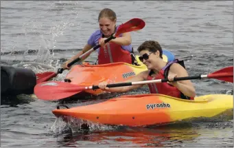  ??  ?? Monica Byrne and Shiela Kavanagh tussle as they make the turn in the canoe races.