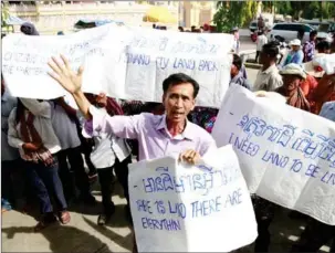  ?? HENG CHIVOAN ?? More than 300 residents from five provinces gathered in front of the Botum Vatey Pagoda in the capital on Monday to protest their long-running land disputes.