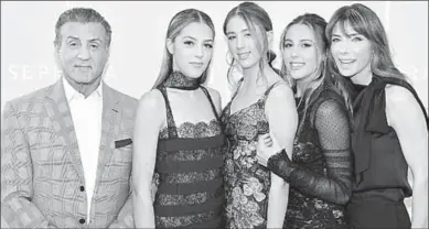  ??  ?? Sylvester and his wife stand next to their daughters, Sophia, Sistine, & Scarlet Stallone. (Photo: justjared)