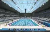  ?? AFP-Yonhap ?? This file photo taken on April 4 shows a general view of the Tokyo Aquatics Center, venue for swimming, diving and artistic swimming at the 2020 Tokyo Olympics and Paralympic­s Games.