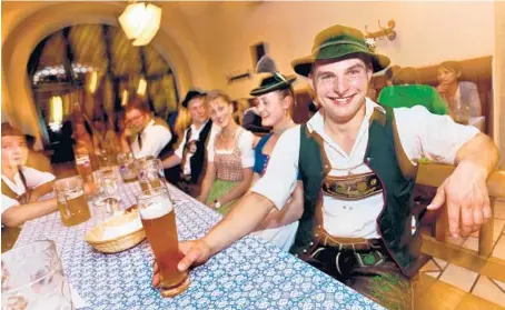  ?? DOMINIC ARIZONA BONUCCELLI ?? At a Bavarian beer hall, you can expect to find men wearing lederhosen.