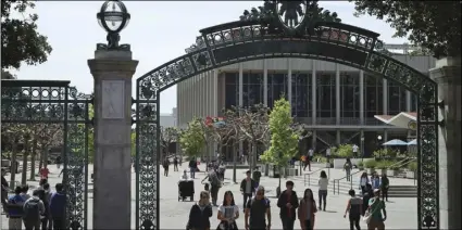  ??  ?? In this May 10, file photo, students walk past Sather Gate on the University of California at Berkeley campus. The University of California has admitted a record number of California­ns for the upcoming 2018-19 school year, including the highest number...