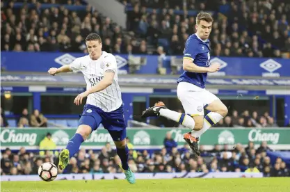  ??  ?? LIVERPOOL: Leicester City’s Robert Huth, left, and Everton’s Seamus Coleman battle for the ball during the English FA Cup, third round soccer match at Goodison Park, Liverpool, England, yesterday. — AP