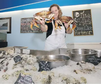  ?? KIM STALLKNECH­T/PNG ?? Heather Jenkins, owner of the 1 Fish 2 Fish Seafood Market in Langley, is pleased her business of 17 years has strong local support.
