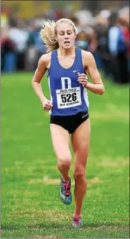  ?? PETE BANNAN — DIGITAL FIRST MEDIA ?? Downingtow­n West’s Aislinn Devlin betterd her state cross county finish from 2015, by winning this year’s girls Class AAA meet in Hershey on Saturday.