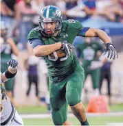  ?? ROBERTO E. ROSALES/JOURNAL ?? The Rams’ Joe Elmalhy breaks away from a Trojans defender during Rio Rancho’s home victory Friday.